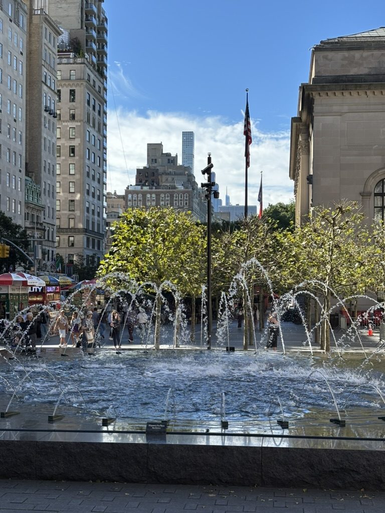 A fountain in Midtown on a bright afternoon
